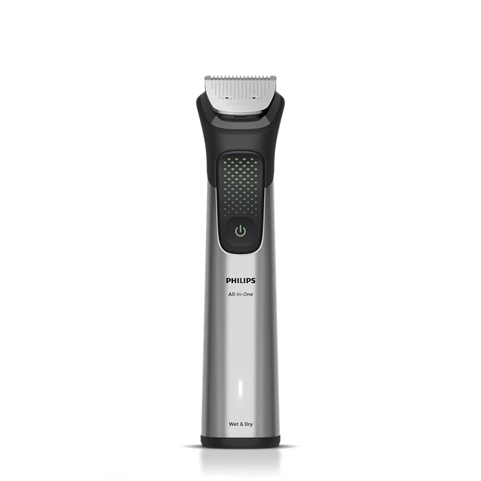 Ein silberner und schwarzer Philips All-in-One-Elektro-Trimmer. Er hat einen Trimmerkopf, einen Ein- /Aus-Schalter und die Aufschrift 'Wet & Dry'. Auf grauem Sockel.
