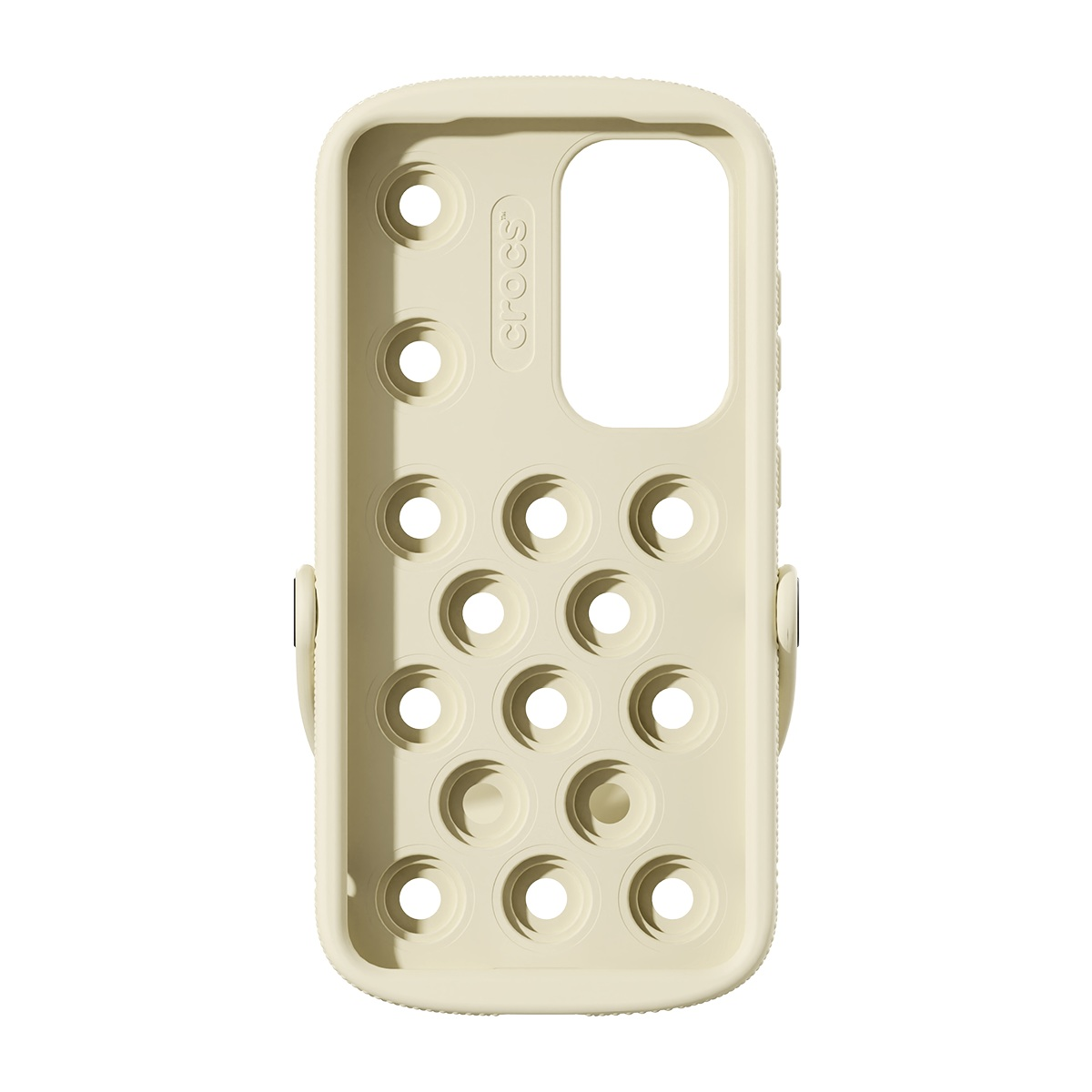 Dairesel delikleri ve Crocs markası olan krem renkli bir telefon kılıfı. Kamera ve yan düğmeler için bir kesik ve bir kayışa sahip.