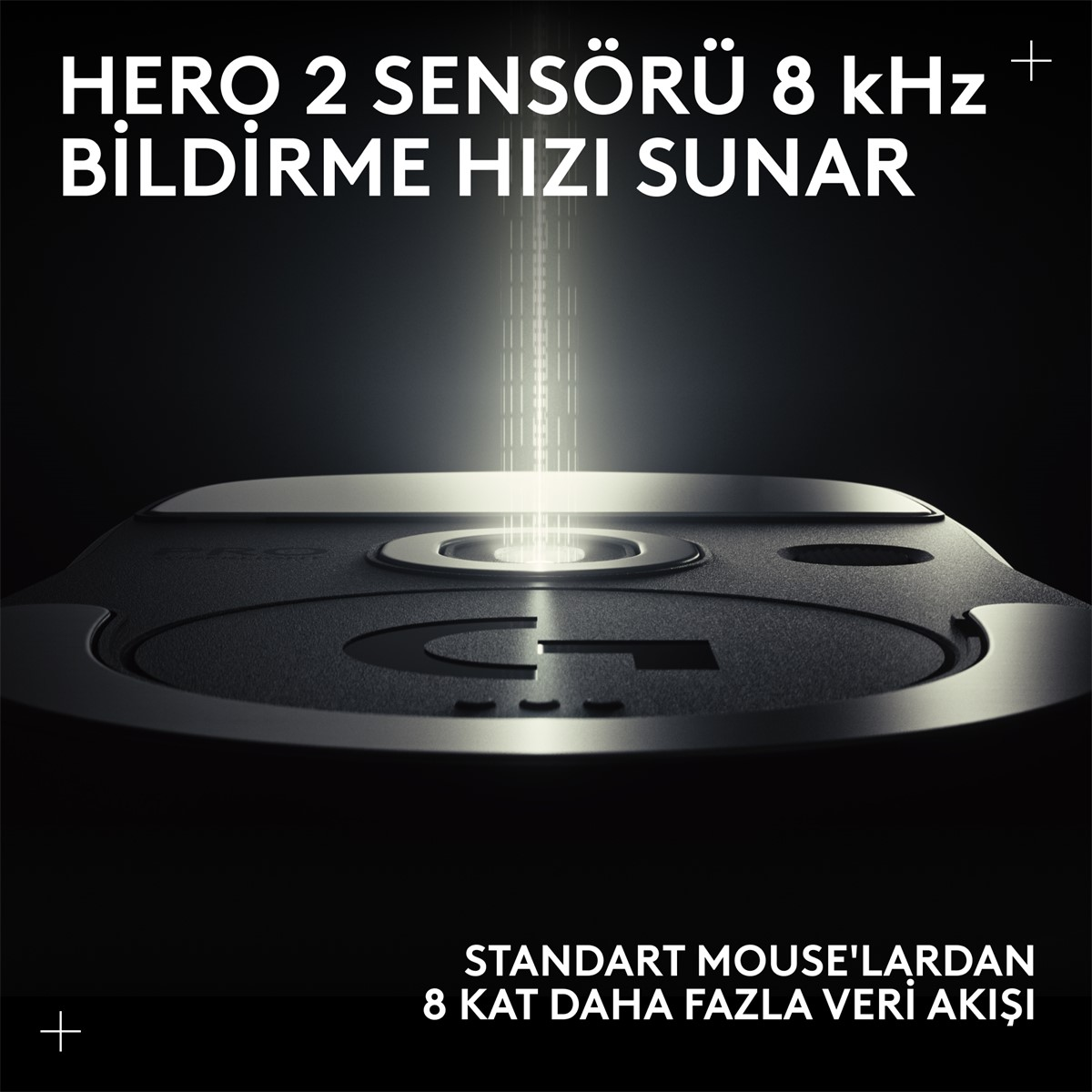 Ortasından ışık huzmesi yayılan, siyah fare benzeri bir cihazın yakın çekimi. Türkçe metin.