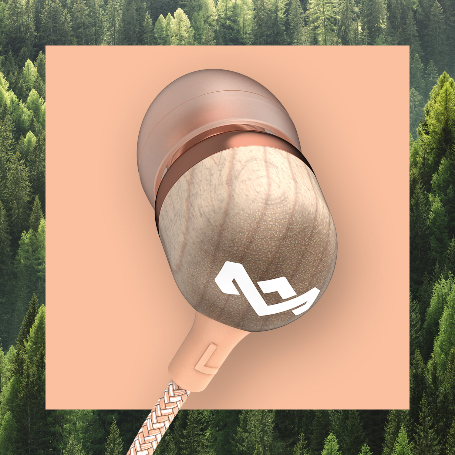Earbud with wooden finish, copper accents, and white logo. Peach background with forest backdrop.