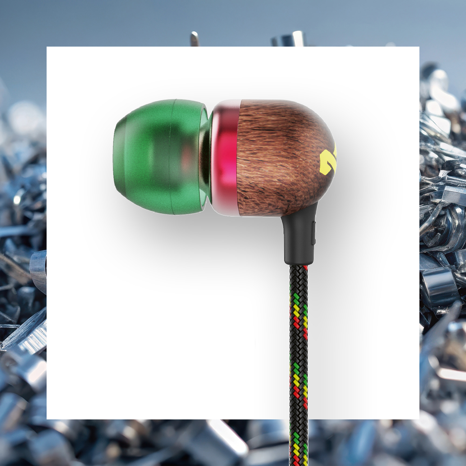 Earbud with green tip, wood-grain body, red ring, black cable with red, yellow, and green accents, on white, with metal background.