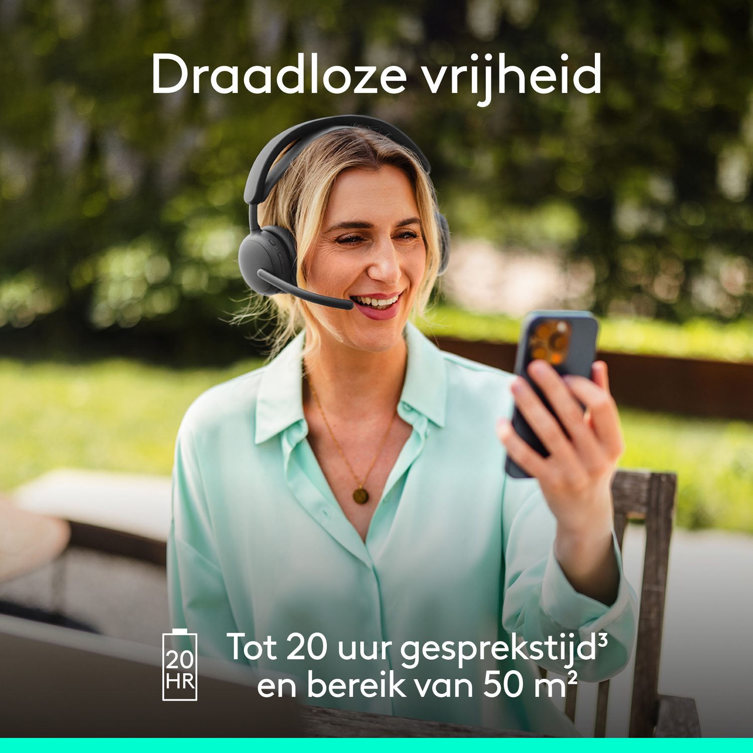 Blonde woman wearing headset, holding a phone. Text says 'Wireless freedom'. Background: greenery.