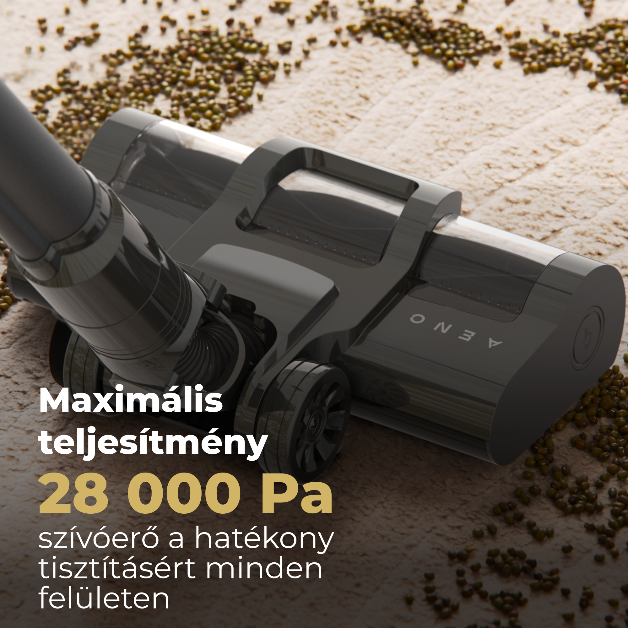 Fekete porszívófej bézs felületen, barna szemcsékkel. A szöveg szerint: 'Maximális teljesítmény 28000 Pa'.
