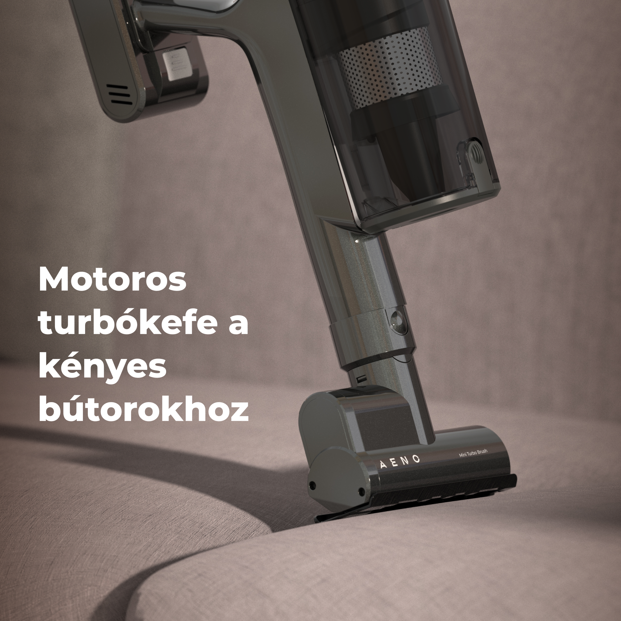 Egy sötétszürke porszívó közelképe a kanapén. A szöveg: Motoros turbókeefe a kényes bútorokhoz.