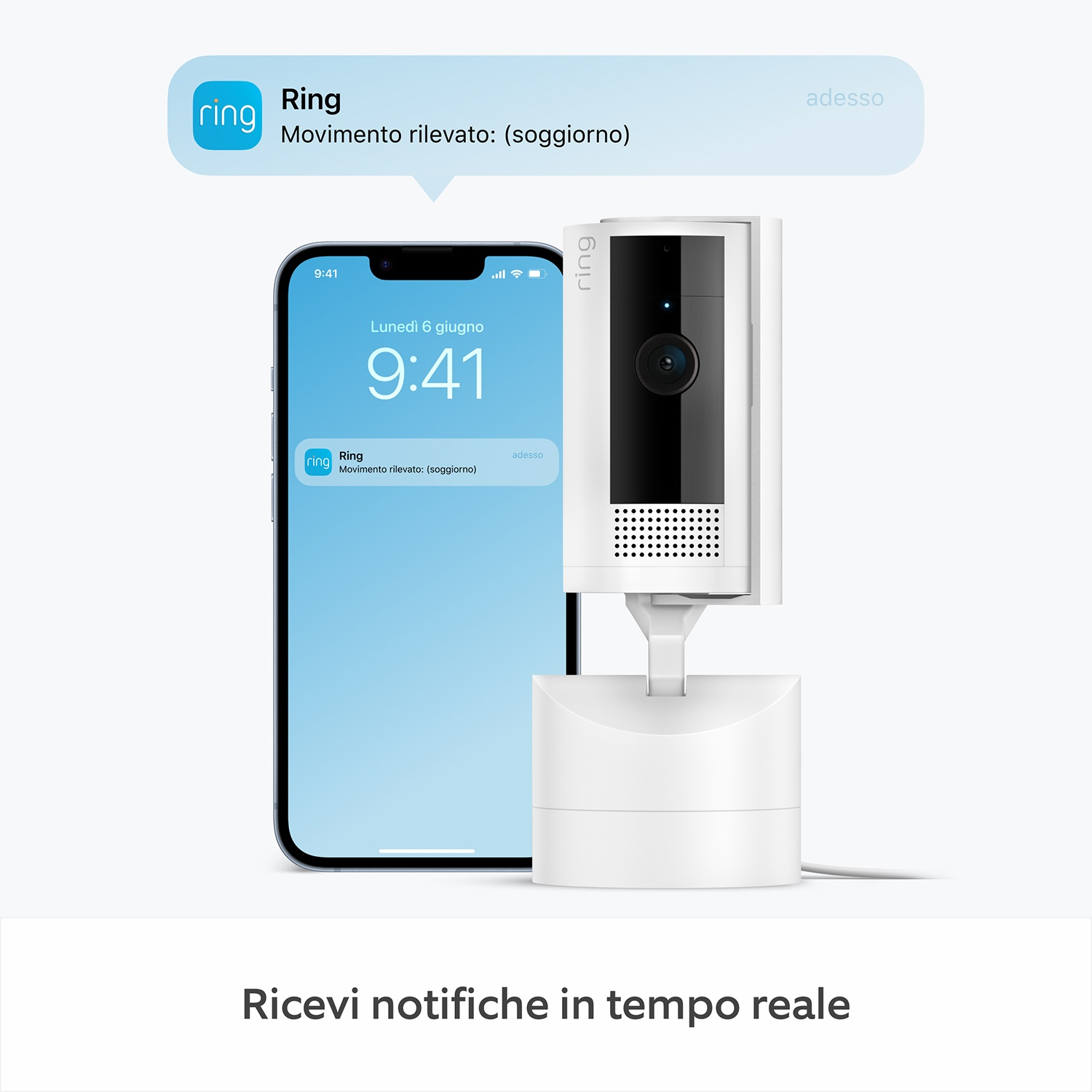 Una telecamera di sicurezza Ring e uno smartphone che mostra una notifica. La notifica dice 'Movimento rilevato: (soggiorno)'.