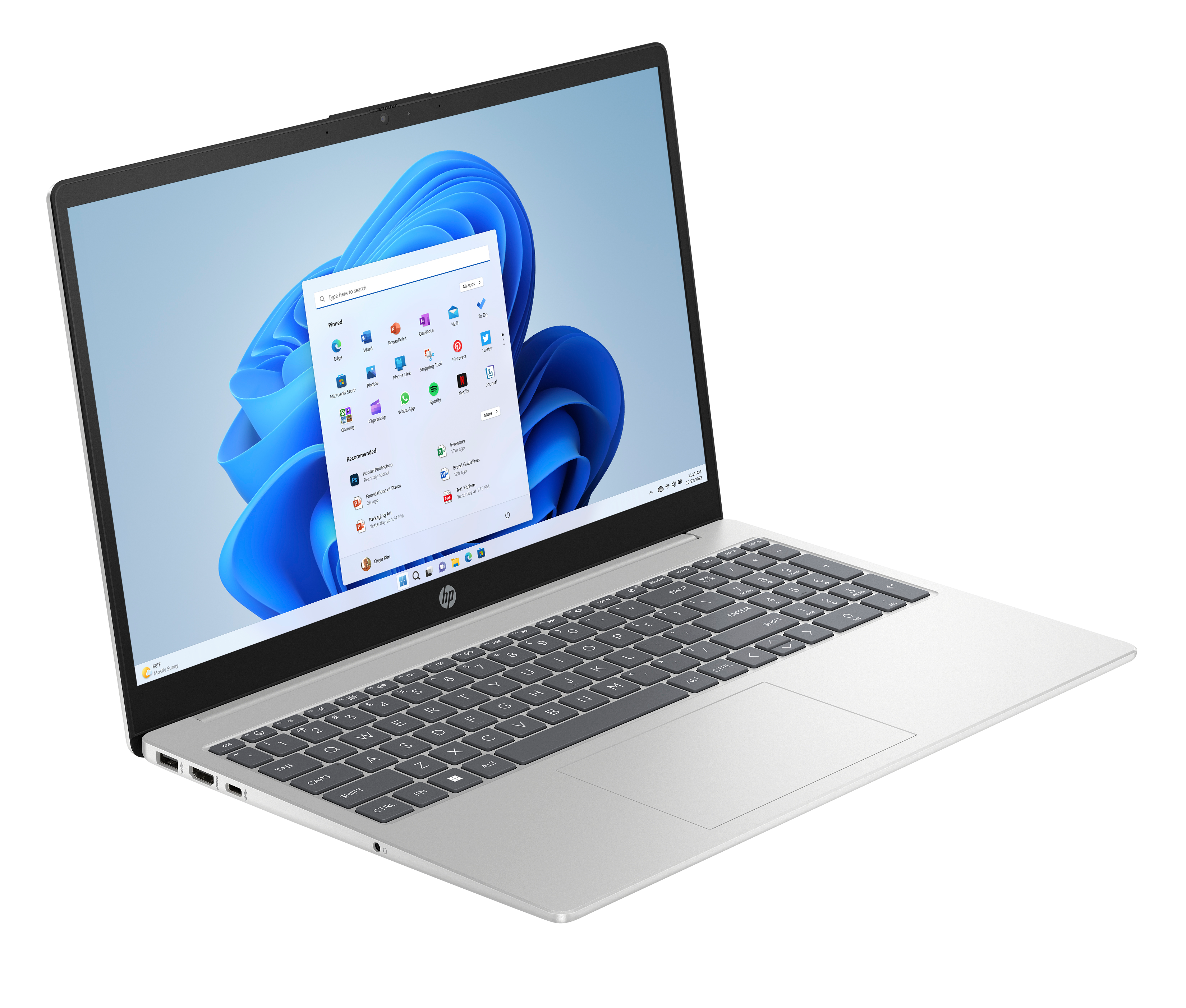 Srebrny laptop HP otwarty, widoczny interfejs Windows 11. Klawiatura, touchpad i ekran w centrum.