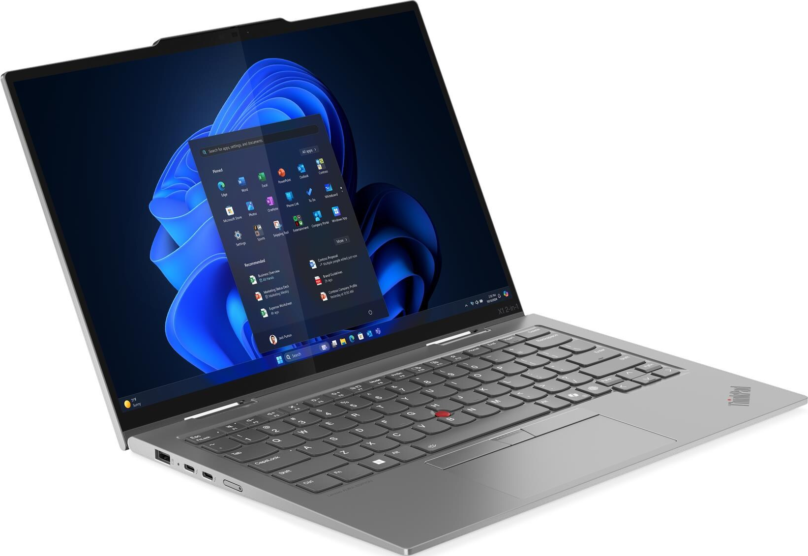 Ein silberner Laptop ist geöffnet und zeigt die Windows 11-Oberfläche mit App-Symbolen und einer Suchleiste. Die Tastatur ist fokussiert.