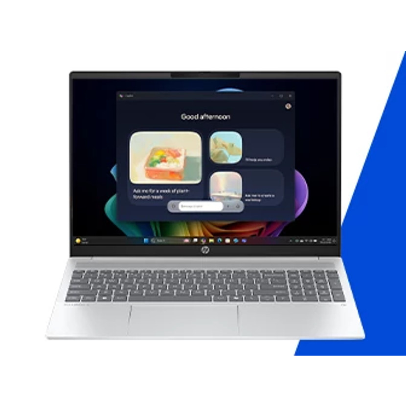 Srebrny laptop z ciemnym interfejsem użytkownika i powitaniem 'Dzień dobry'. Ekran pokazuje zdjęcia jedzenia i ikony aplikacji. Niebieskie i białe tło.