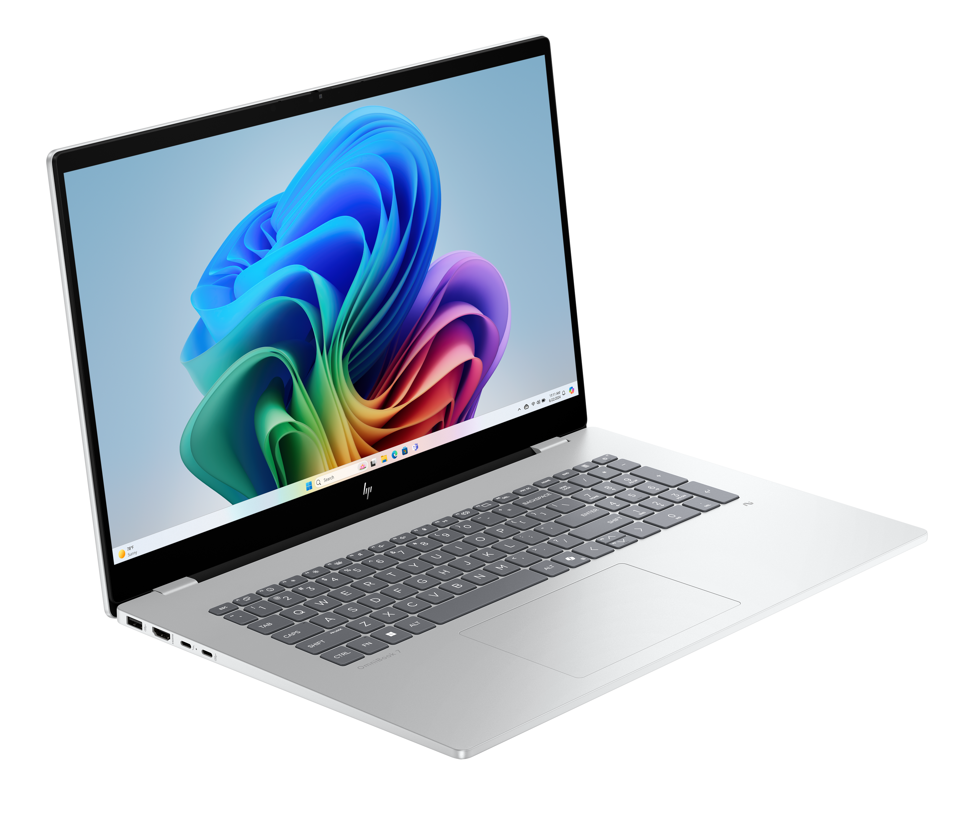 Srebrny laptop HP otwarty, wyświetlający kolorowy abstrakcyjny obraz. Klawiatura widoczna. Czarne tło.