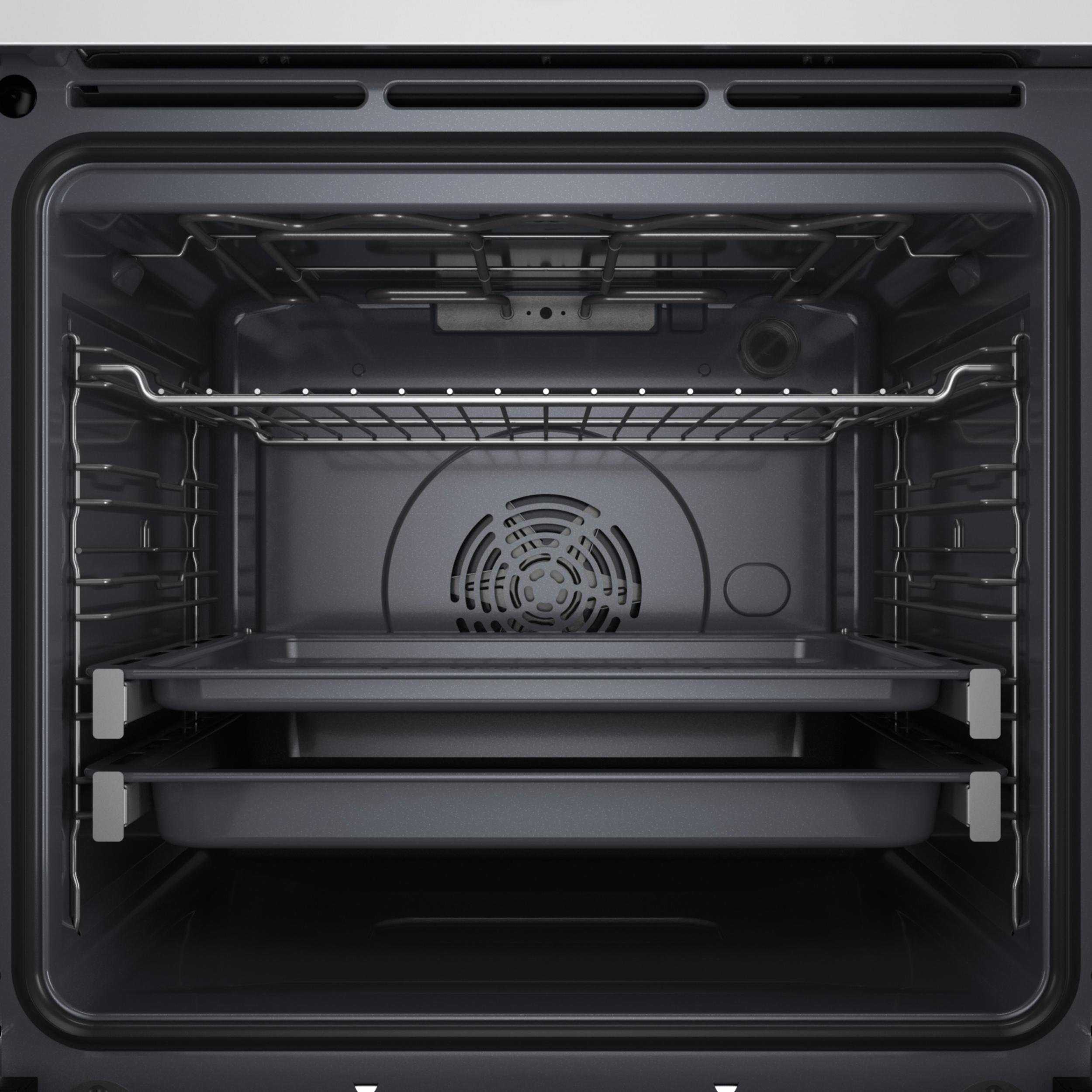 Wnętrze czystego piekarnika. Widoczne metalowe ruszty, wentylator i dwie tace. Wnętrze jest ciemnoszare.