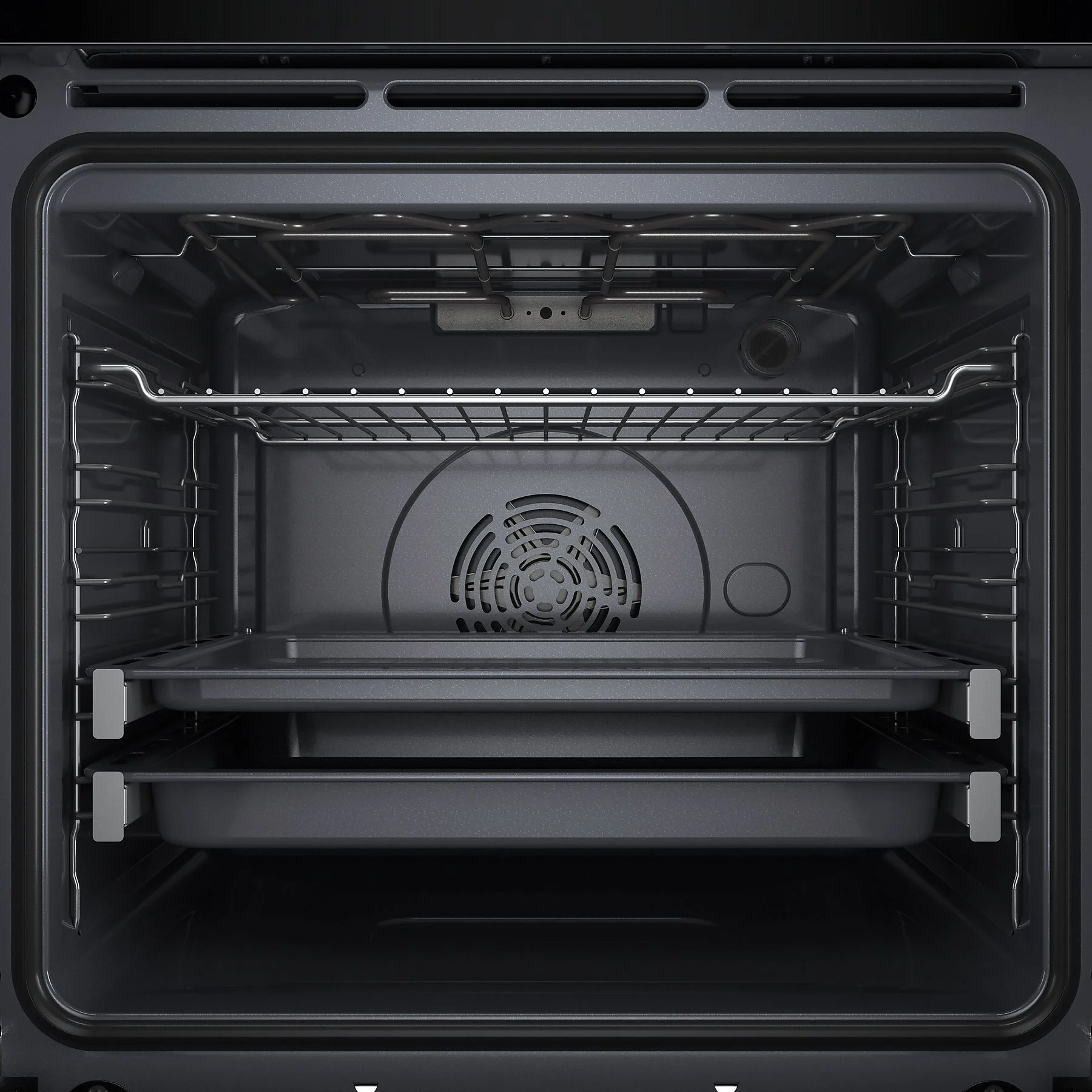 Widok wewnątrz ciemnoszarego piekarnika. Ma metalowe ruszty i tace. Z tyłu widoczny jest wentylator.
