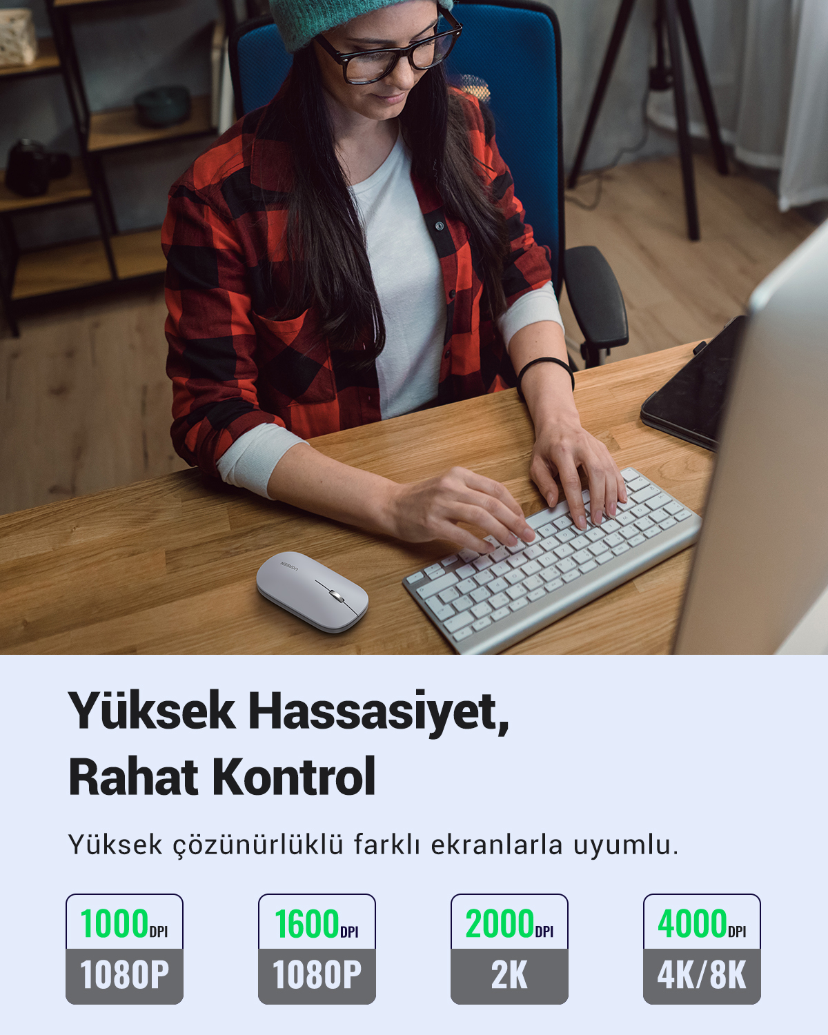 Gözlüklü ve bere takan kadın masada klavyede yazıyor. Sol tarafta fare var. Metin: Yüksek Hassasiyet, Rahat Kontrol.