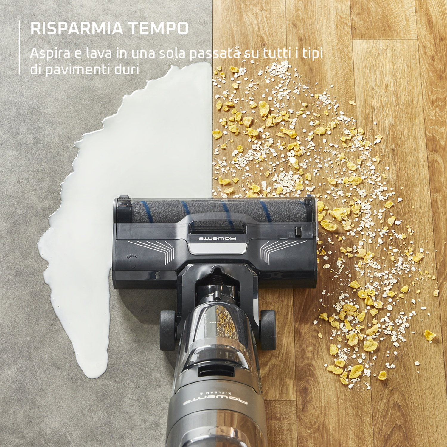 Un aspirapolvere pulisce latte e cereali versati su due tipi di pavimento. Un lato è piastrellato grigio, l'altro in legno.