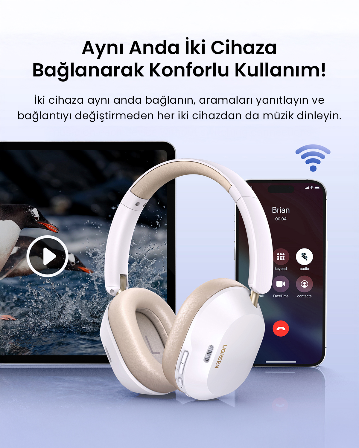 Beyaz ve bej kulaklıklar telefon ve tabletin yanında. Telefonda bir arama ekranı gösteriliyor. Tablette penguenler var.