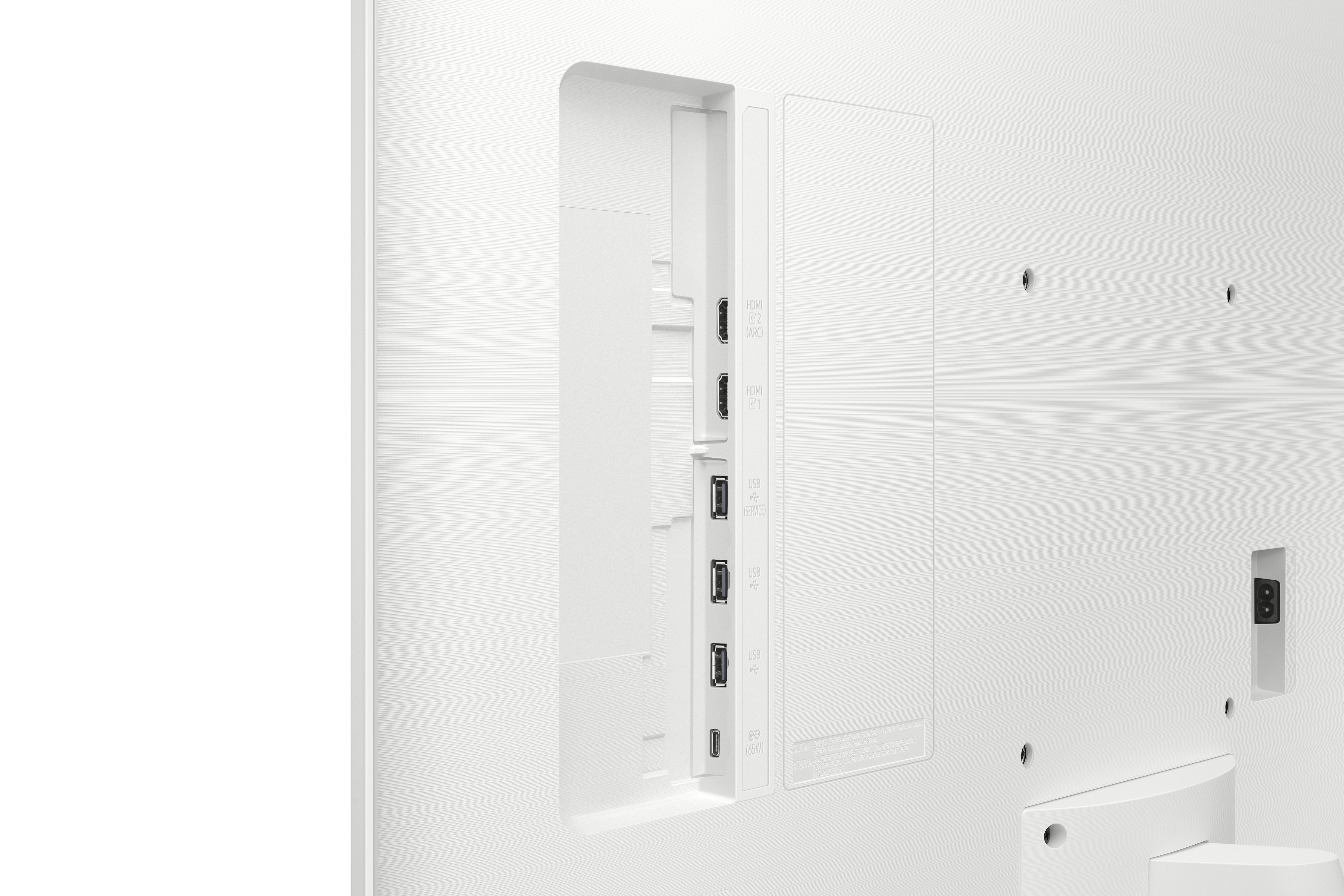 Parte trasera de un televisor blanco que muestra puertos: HDMI, USB y alimentación. La superficie tiene un patrón texturizado.
