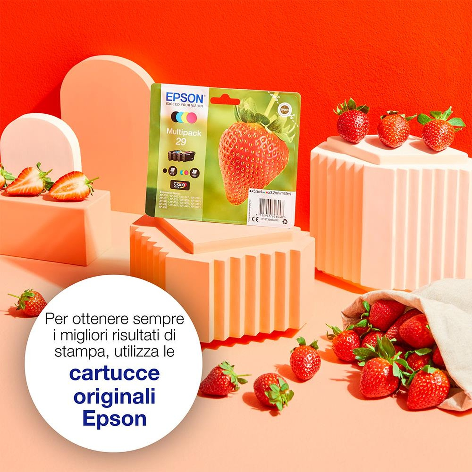 L'immagine presenta inchiostro per stampanti Epson, fragole e un'esposizione del prodotto. Le fragole cadono da un sacchetto. La confezione mostra una grande fragola.