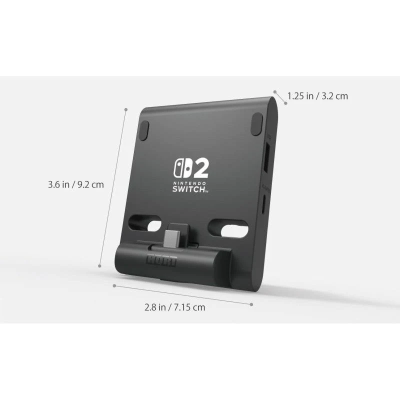 Un soporte negro para Nintendo Switch con el logotipo de Switch y dimensiones. El soporte está sobre una superficie blanca.