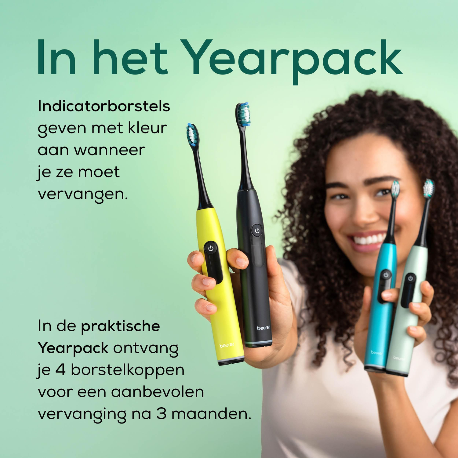 A woman holding four electric toothbrushes of different colors. Text about the product is visible in the background.