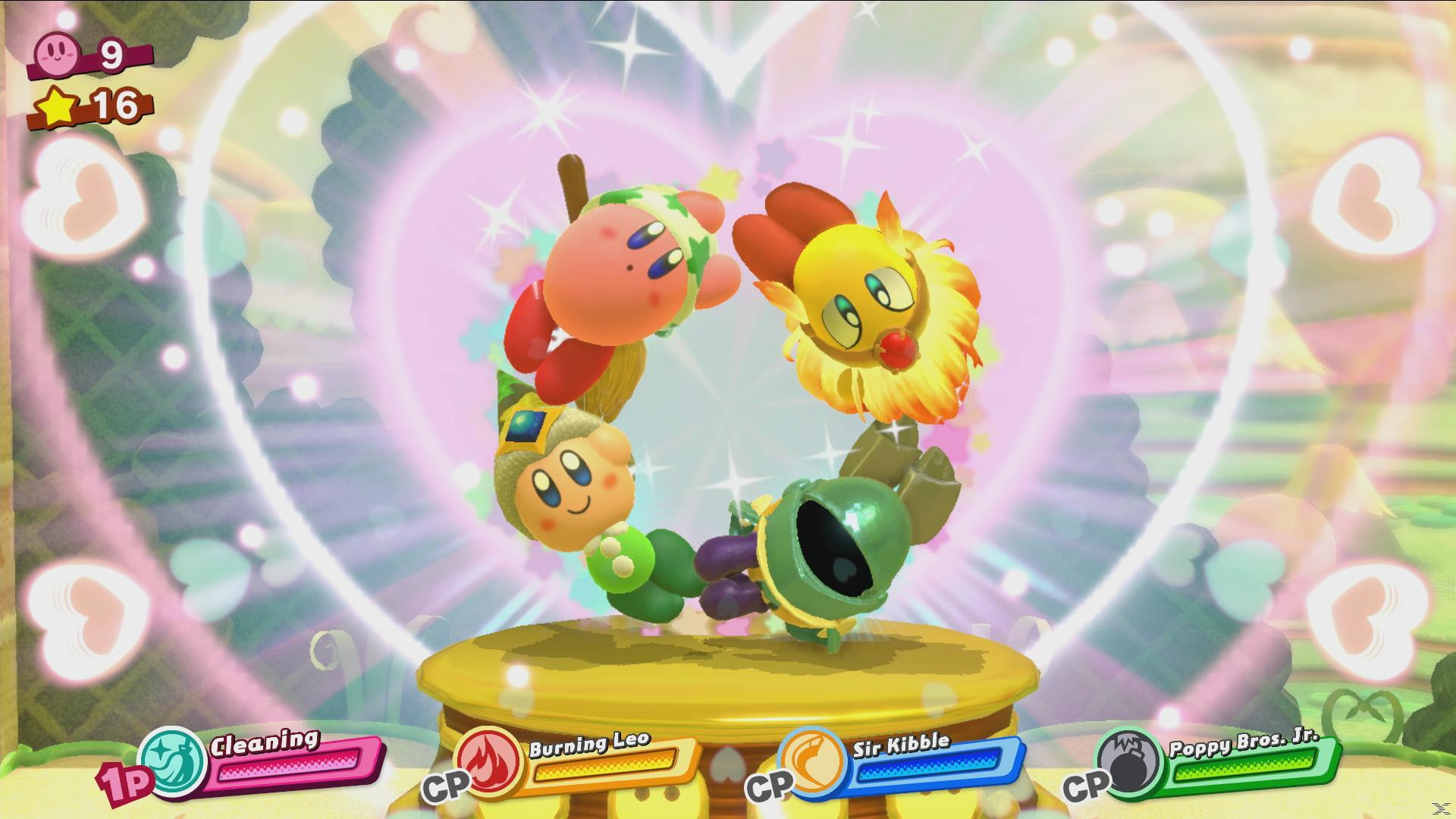 Kirby i przyjaciele w ramce w kształcie serca. Są na złotej platformie, z paskami zdrowia i ikonami wyświetlanymi poniżej.
