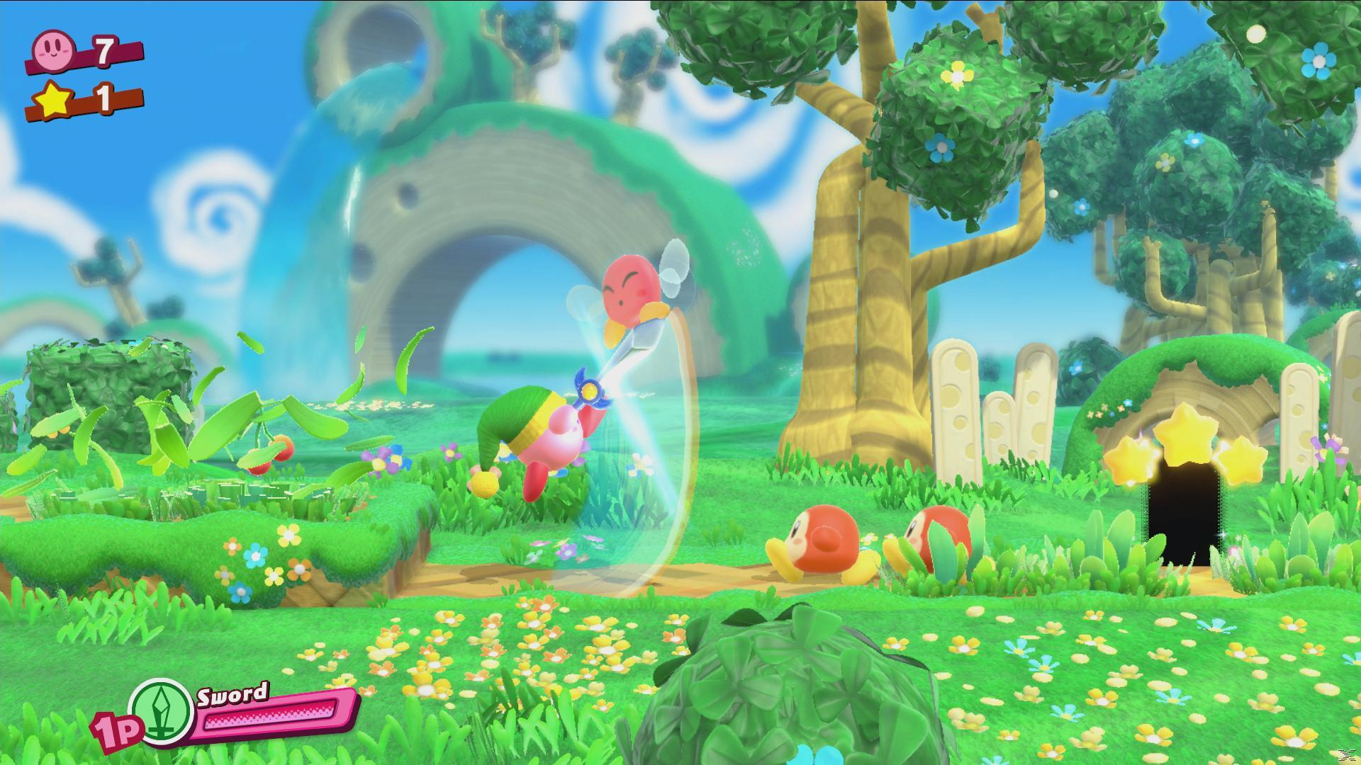 Kirby z mieczem atakuje wrogów. Scena obejmuje trawiasty teren, drzewa i wejście do jaskini z gwiazdami.