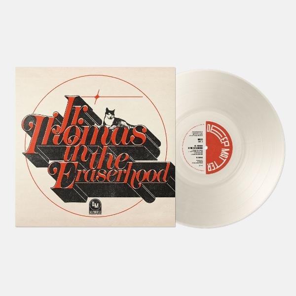 Ein Vinyl-Album mit dem Titel 'Thomas in the Fraserhood'. Ein Husky-Hund ist auf dem Cover. Die Schallplatte ist weiß.
