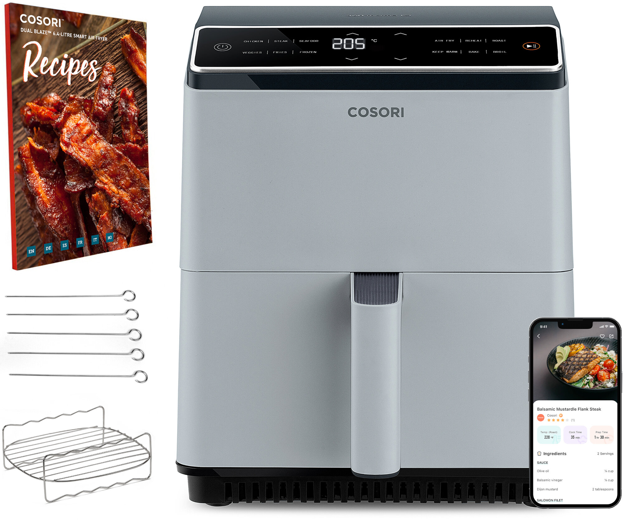 Frytkownica beztłuszczowa z przepisami, akcesoriami i telefonem z przepisem na stek. Frytkownica jest szara, a książka kucharska pokazuje jedzenie.