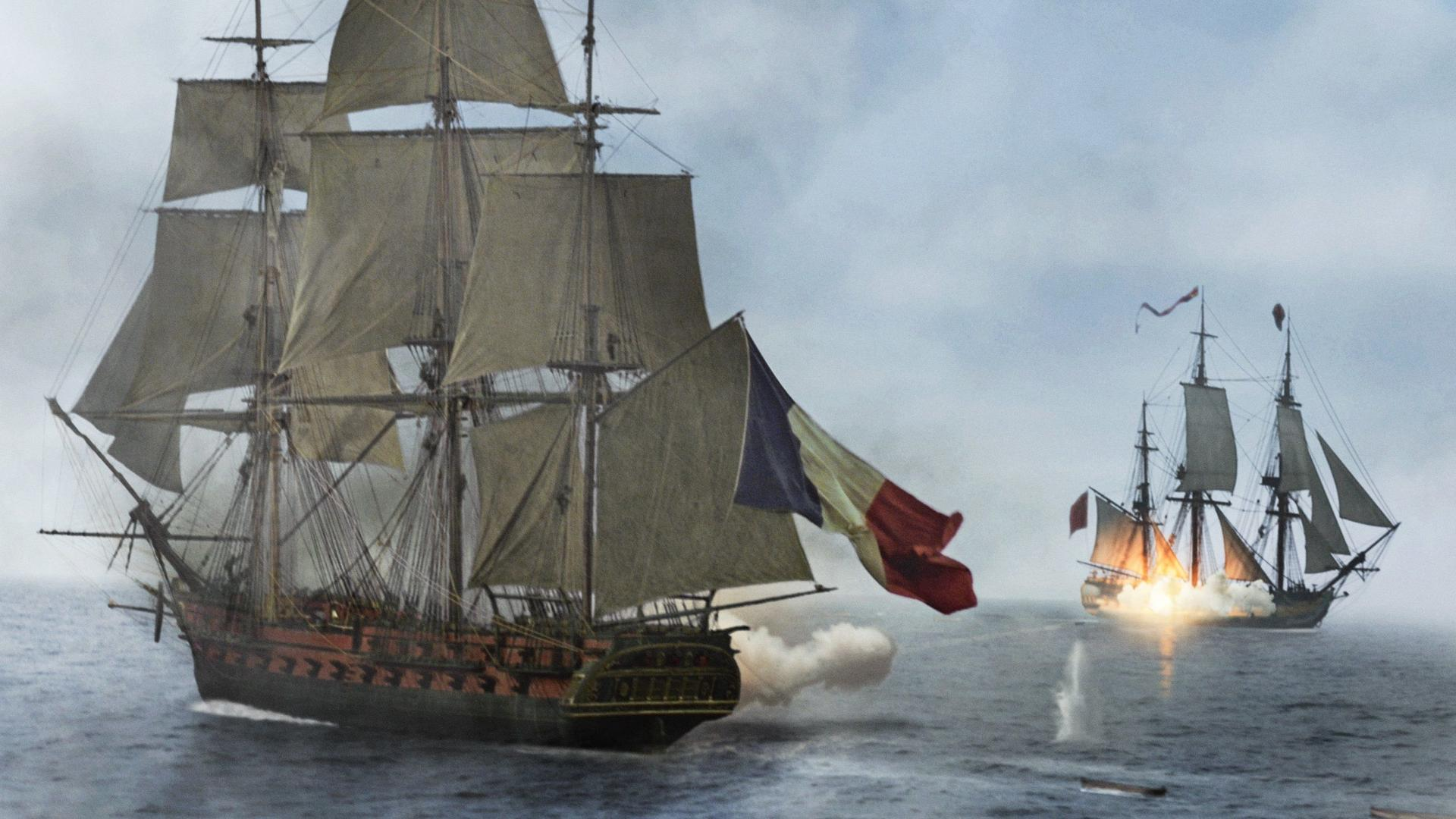Zwei Segelschiffe auf See, eines mit französischer Flagge, schießen auf das andere. Explosion auf dem zweiten Schiff.