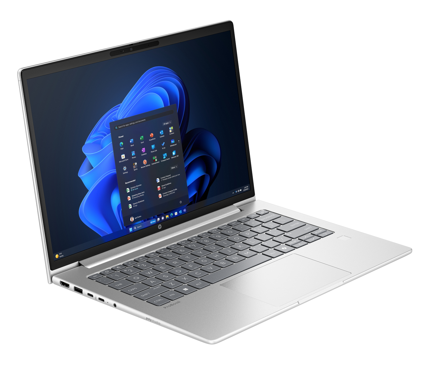 Un portátil plateado muestra el menú de inicio de Windows 11, con fondo azul y blanco. Teclado visible con el panel táctil.