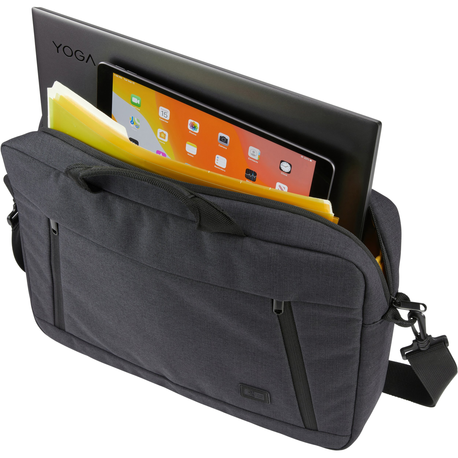 A gray laptop bag holds a laptop, a tablet, and files. The laptop displays "YOGA." The tablet shows the home screen.