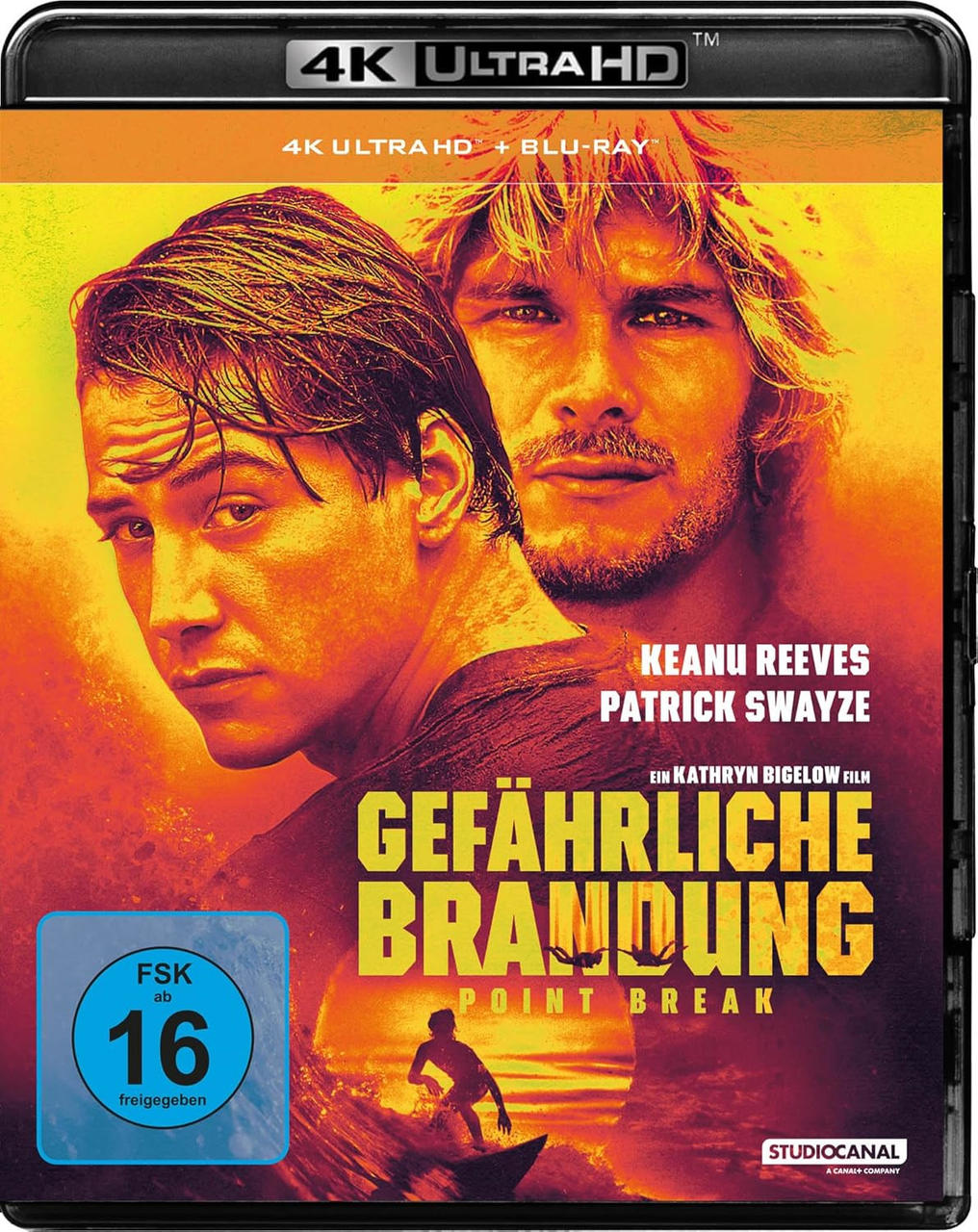 Filmcover für Point Break. Zeigt Keanu Reeves und Patrick Swayze. Der Titel ist auf Deutsch, mit einer Surfer-Silhouette.