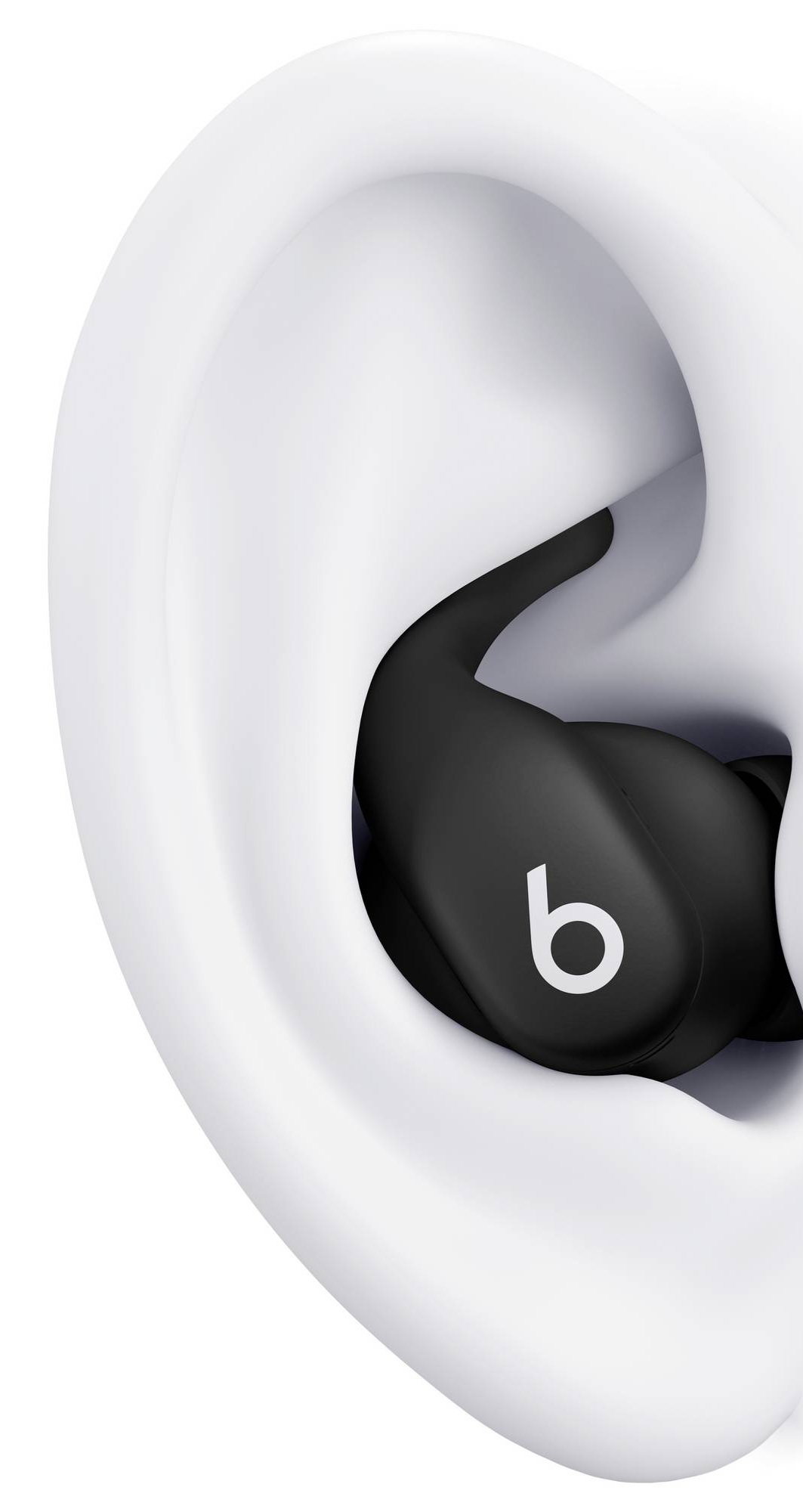 Czarny pączek Beats z białym logo 'b' jest włożony do białego ucha. Pączek jest w kanale słuchowym.