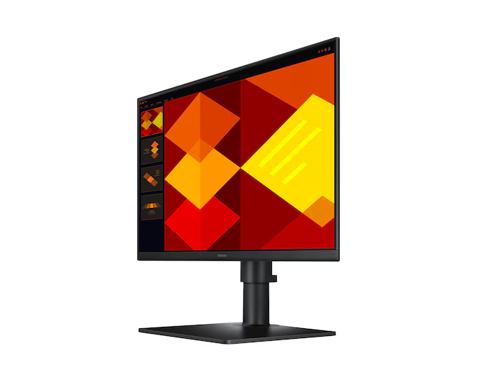 Egy fekete számítógép-monitor, amely színes geometriai mintát jelenít meg. A monitor fekete állványon van, fehér háttér előtt.