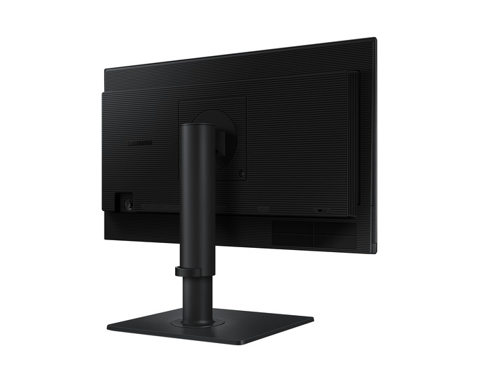 Egy fekete Samsung monitor hátulról. Téglalap alakú képernyővel, középső állvánnyal és négyzet alakú talppal rendelkezik. A háttér fehér.