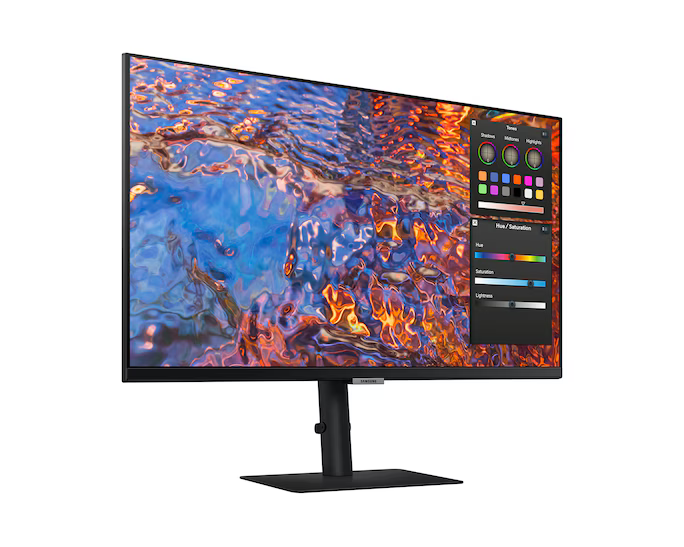 Egy Samsung monitor, amely egy színes, absztrakt képet jelenít meg, látható színbeállító vezérlőkkel. A monitor fekete állványon áll.