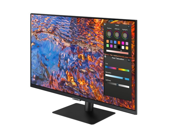 Egy Samsung monitor színes absztrakt művészetet jelenít meg. Egy színpaletta és egy beállítási panel fedi a képernyőt.