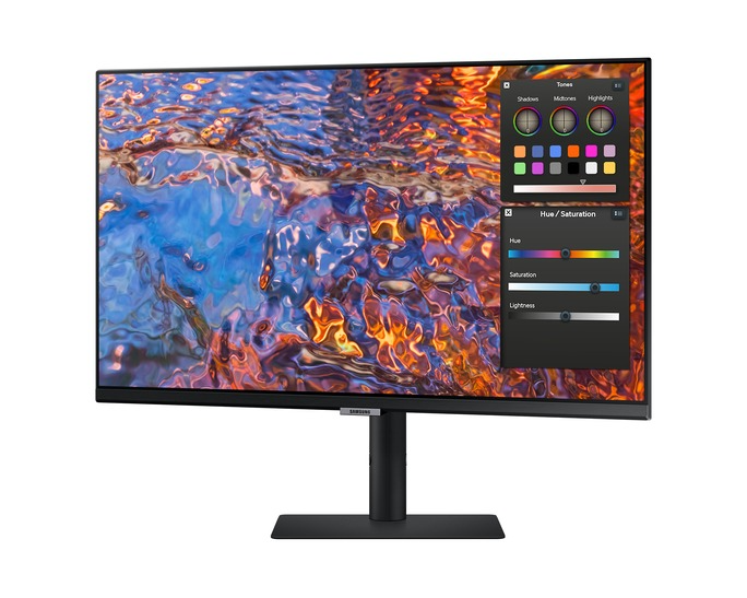 Egy Samsung monitor színes absztrakt képet jelenít meg. A szoftverfelület színtónusokat és színárnyalat/telítettség vezérlőket mutat, fehér háttéren.