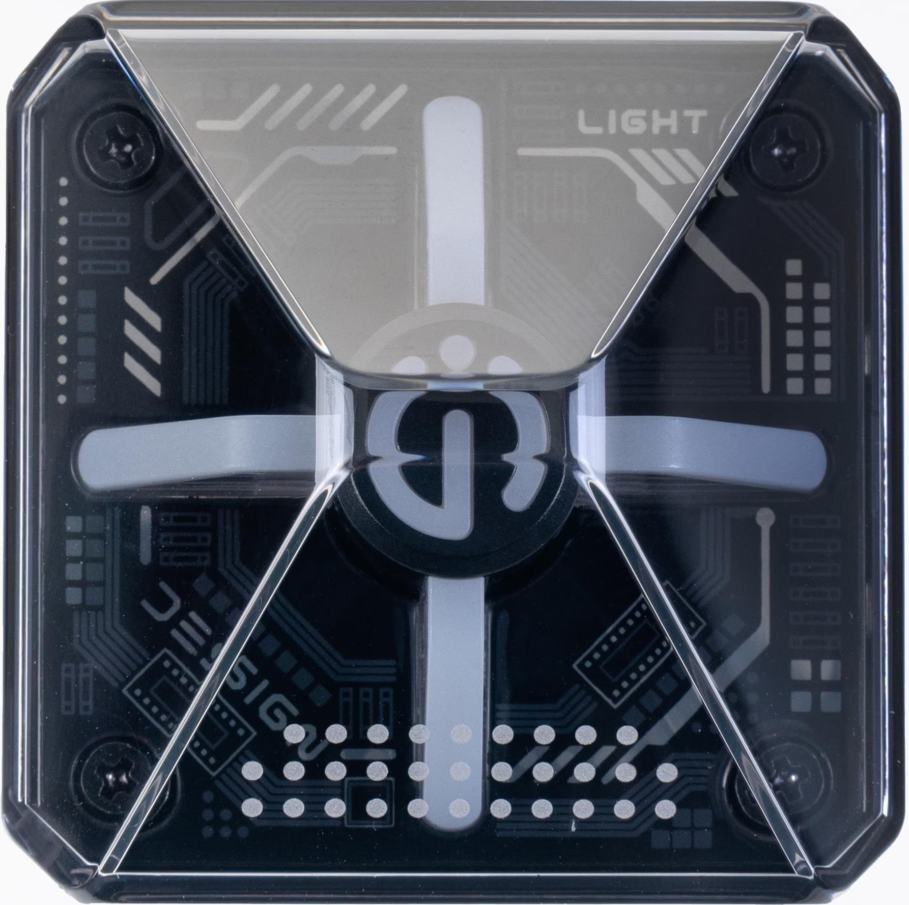Un dispositivo elettronico quadrato nero. Ha accenti grigio chiaro e un rivestimento in plastica trasparente con viti.