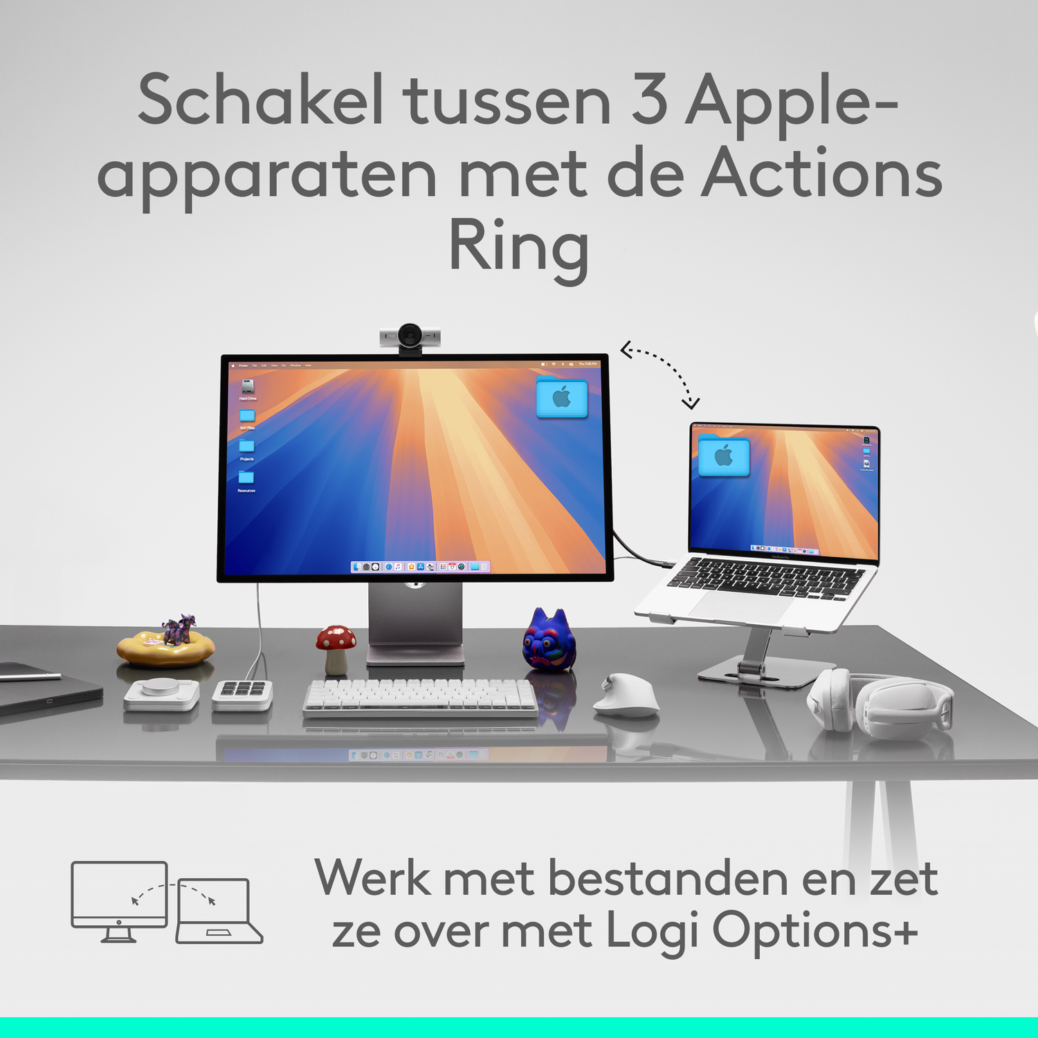 A desk with a computer and a laptop. The screens show the Apple logo. Various accessories are on the desk.