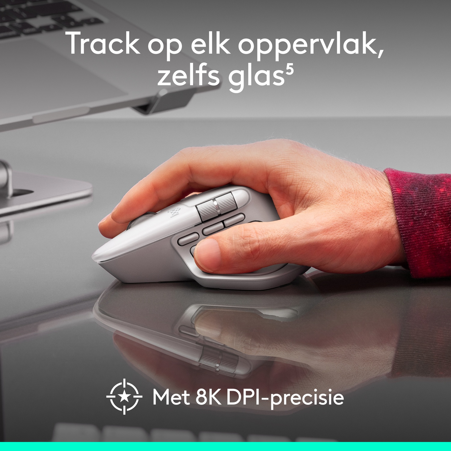 A hand uses a gray mouse on a reflective surface. Text says, 'Track on any surface, even glass' and 'With 8K DPI precision'.