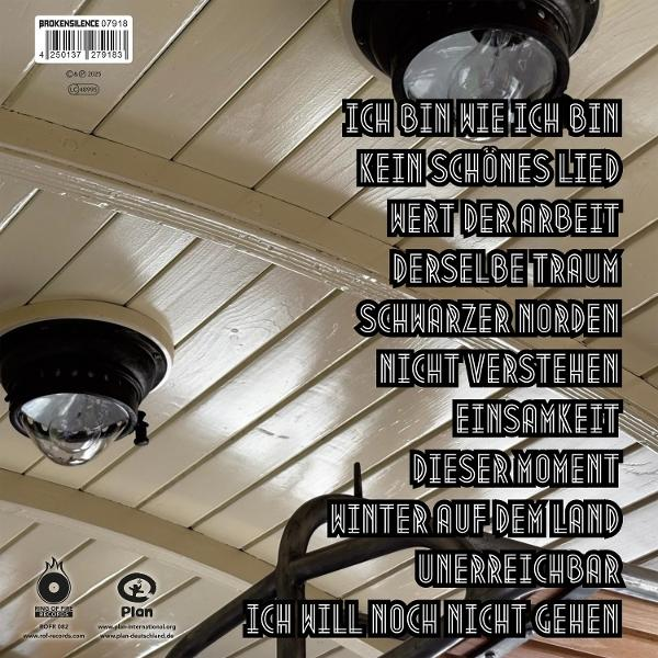 Albumcover mit deutschem Text, schwarzen Lampen und Holzdecke. Titel sind 'Ich Bin Wie Ich Bin' und 'Winter Auf Dem Land'.