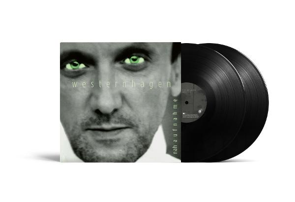 Albumcover mit einem Männergesicht, grünen Augen und zwei schwarzen Schallplatten. Das Album trägt den Titel "Westernhagen".