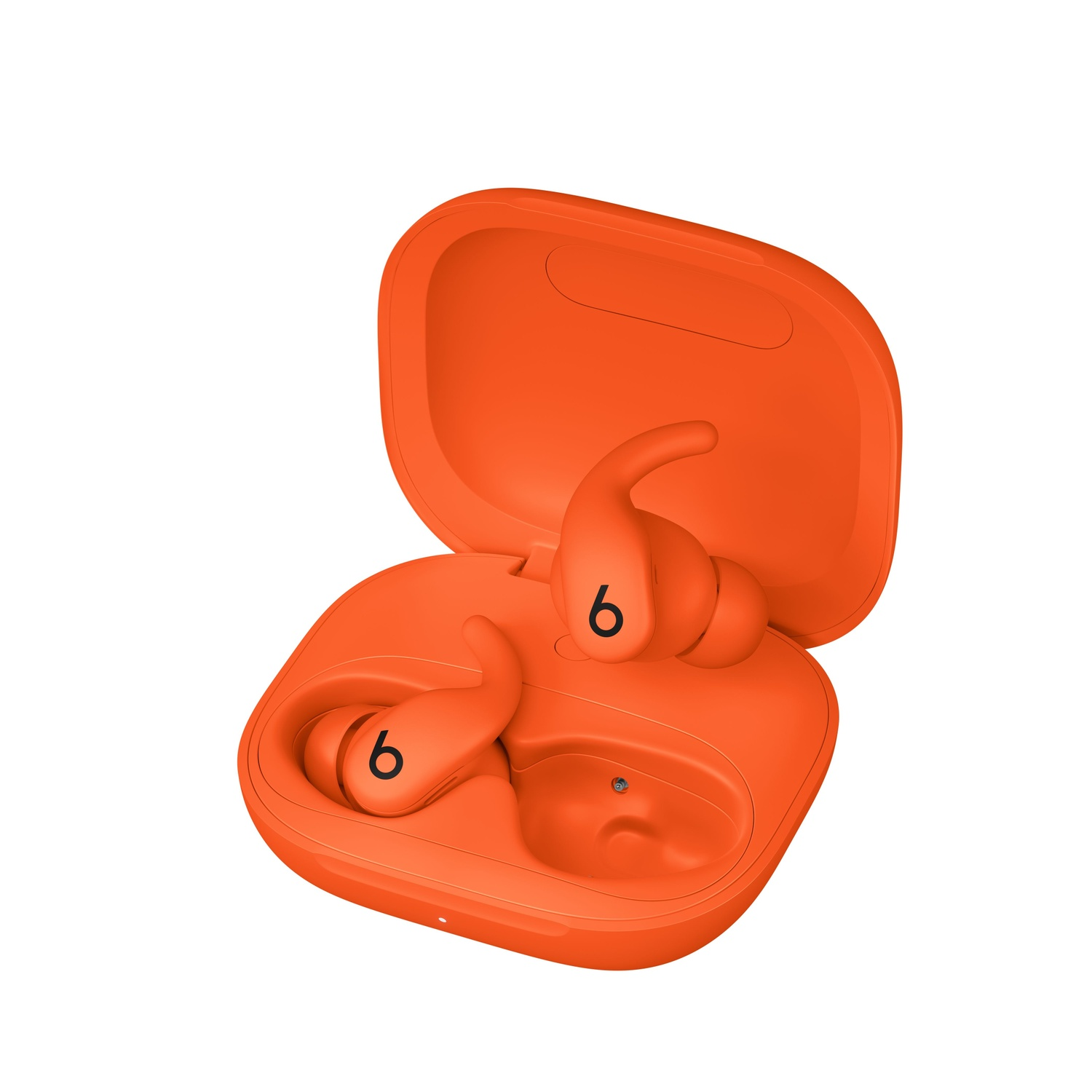 Orange Beats earbuds in an open orange case. Earbuds have a 'b' logo. The case is open, displaying the earbuds and charging area.