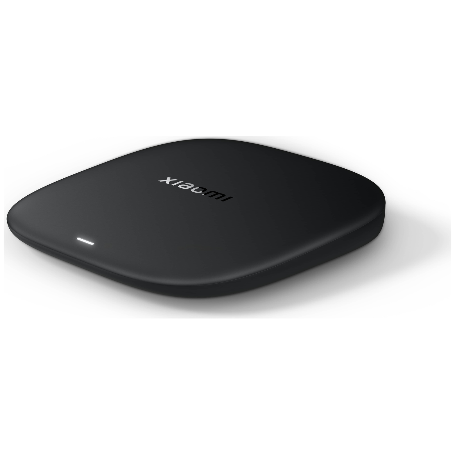 A black, wireless charging pad with the Xiaomi logo in white. It is on a white surface with a small white light on the front.