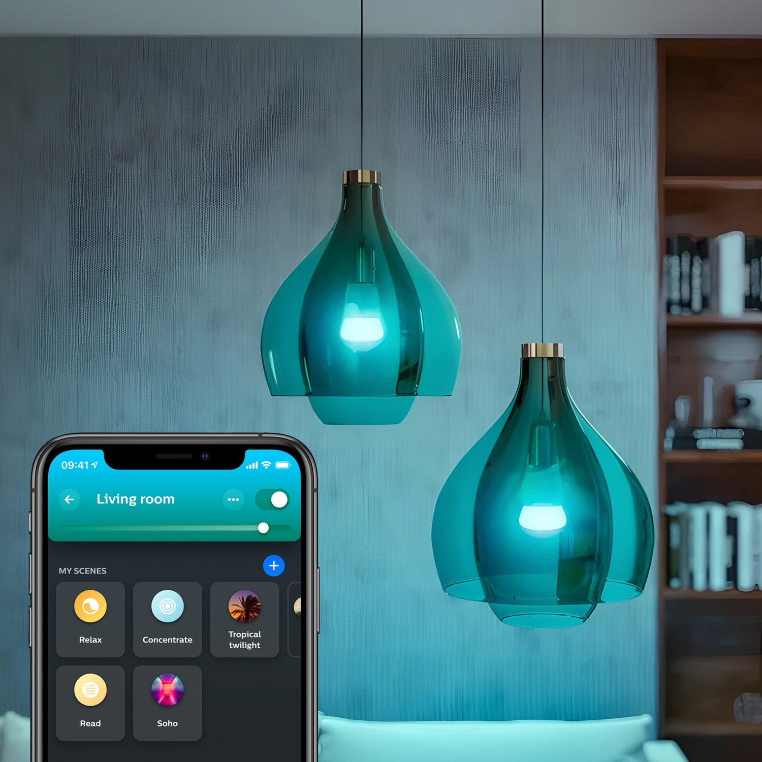 Two teal glass pendant lights hang above a couch. A phone displays smart home controls, with scenes like 'Relax' and 'Concentrate'.
