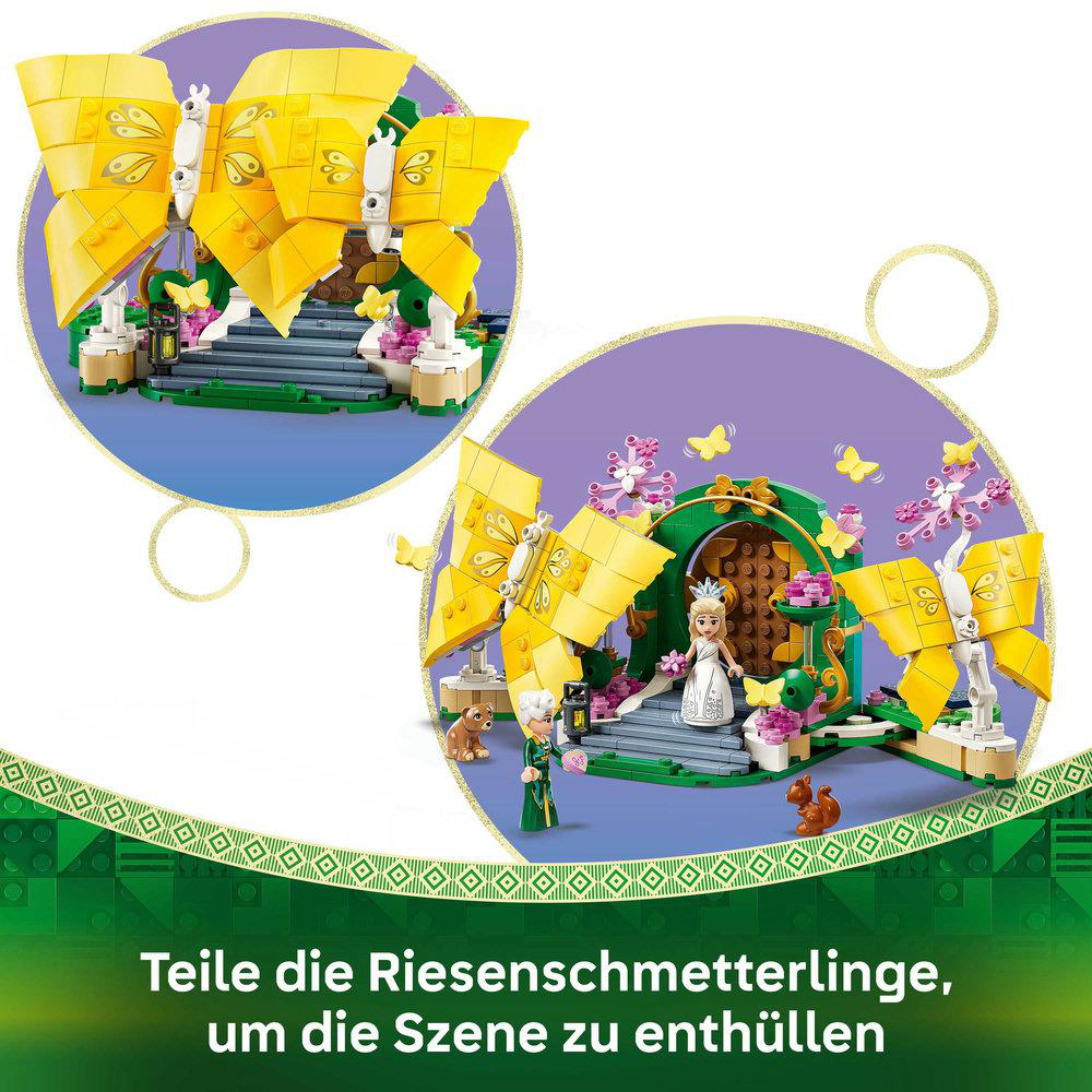 Ein Set mit gelben Schmetterlingsflügeln, Figuren und einer Szenenenthüllung. Der Text unten besagt, die Szene zu enthüllen.