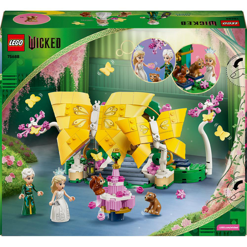 LEGO Wicked-Set-Box. Enthält eine große gelbe Schmetterlingsstruktur, Figuren und ein rosa Schloss. Grüner und rosa Blumenhintergrund.