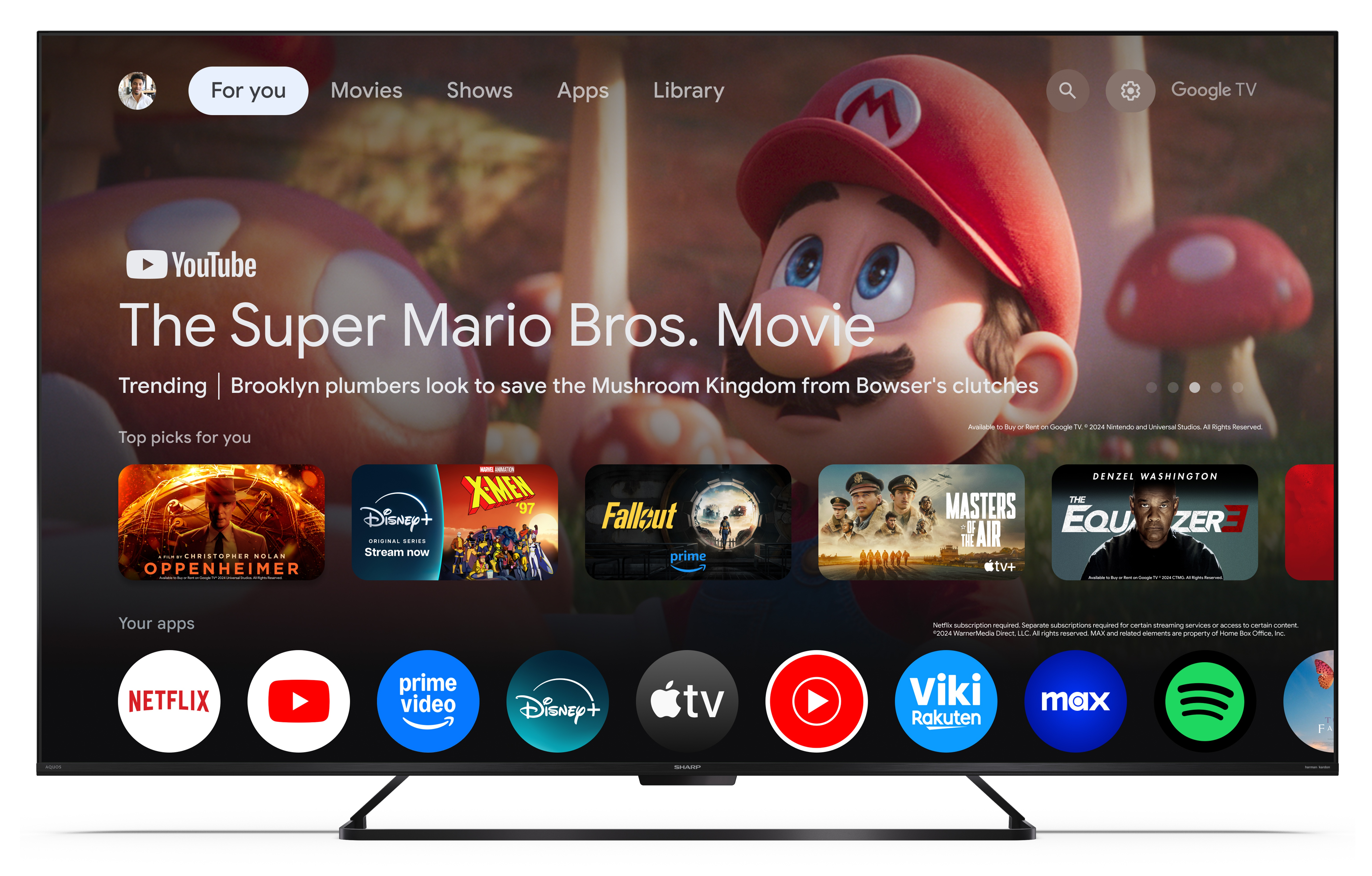 Ekran telewizora wyświetla film Super Mario Bros., różne aplikacje i grafikę postaci Mario.