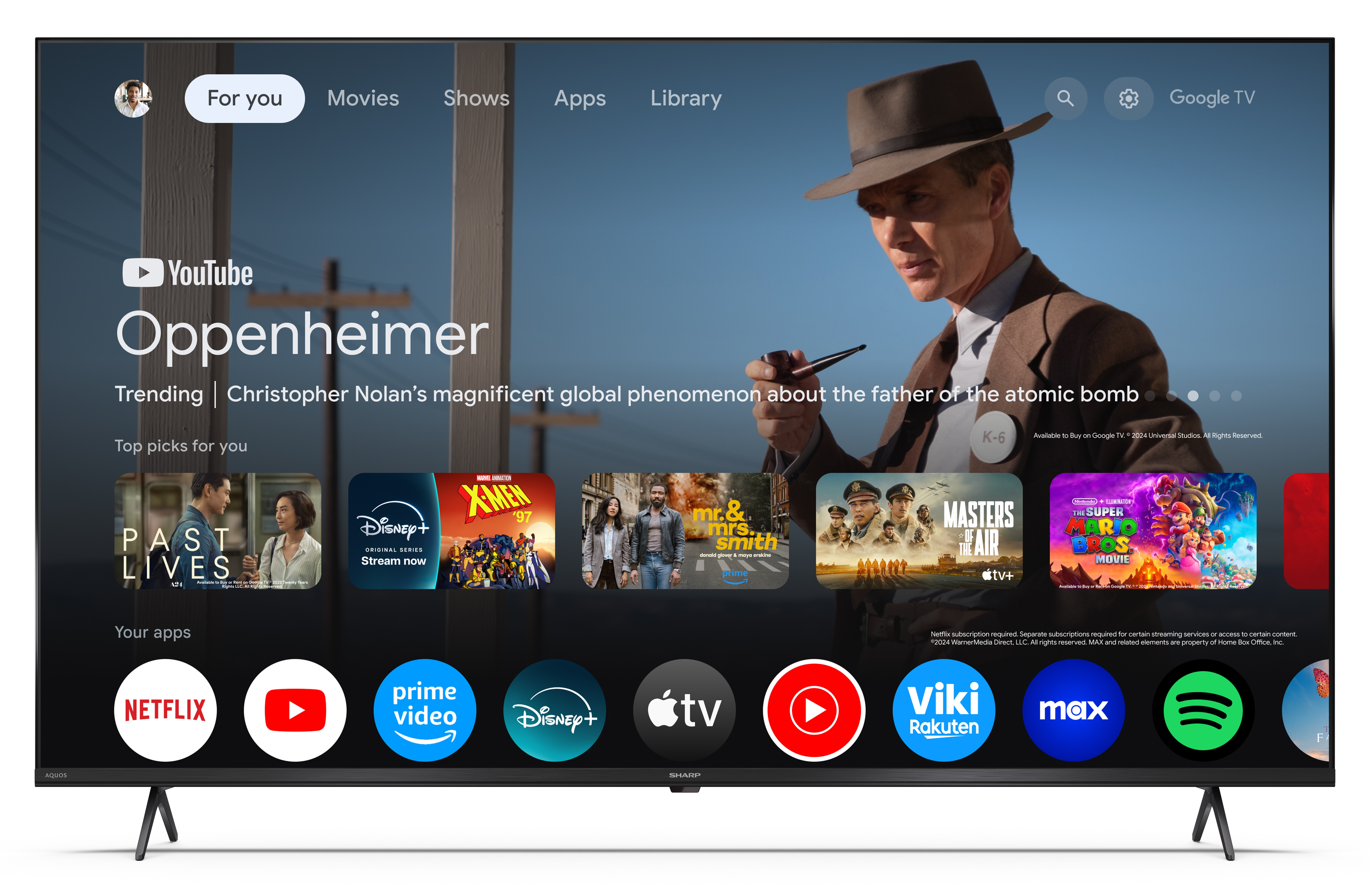 Ekran telewizora wyświetla film Oppenheimer. Widoczne są również aplikacje, takie jak Netflix i YouTube.