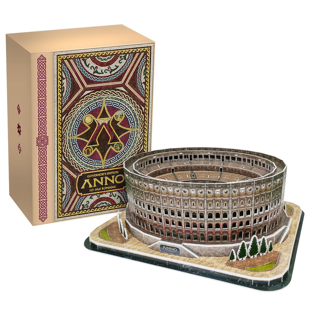 Ein 3D-Puzzle des Kolosseums neben einer Schachtel. Die Schachtel hat bunte Muster mit dem Wort ANNO darauf.