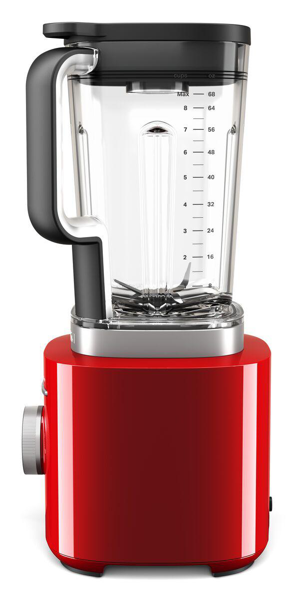 Ein roter Mixer mit schwarzem Deckel und durchsichtigem Behälter. Er hat ein Zifferblatt und Markierungen an der Seite.